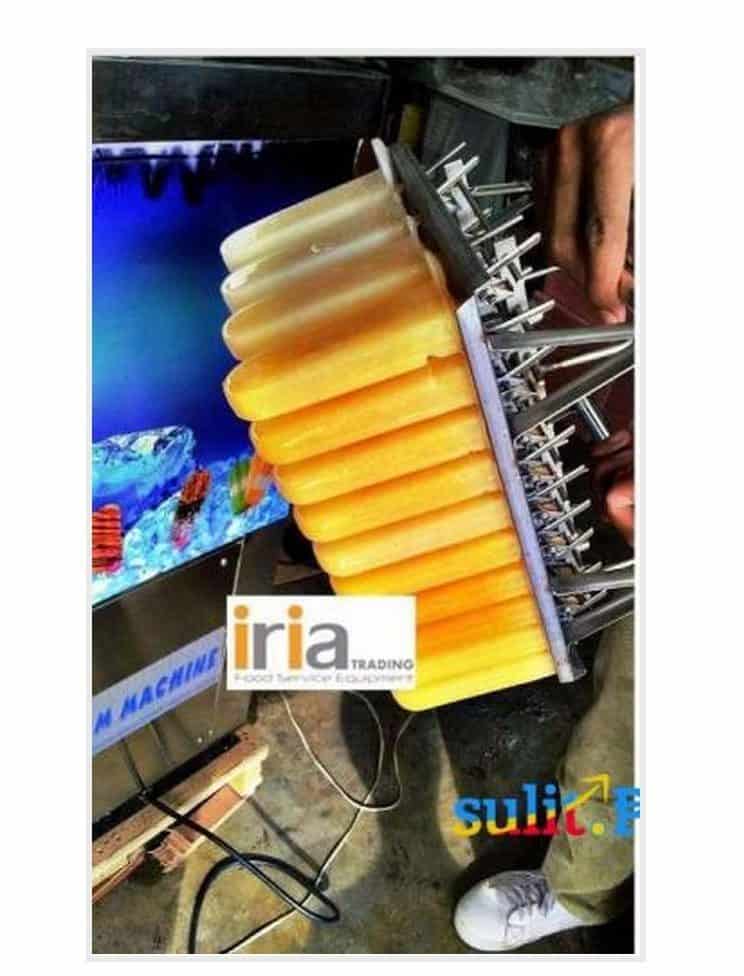 A person is starting a food business making popsicles in front of a tv.