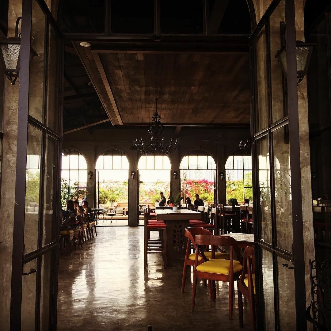 The #balaydako restaurant exudes a welcoming ambiance with its tables and chairs at the entrance.