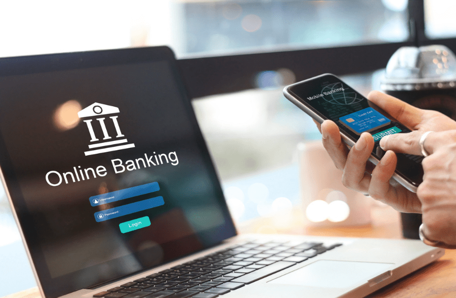 A person is accessing online banking on their laptop to view Philippine Bank Swift Codes.