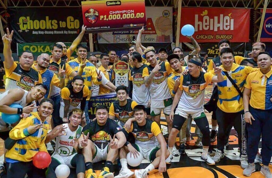 A group of men posing for a photo with balloons celebrate their victory as Basilan Peace Riders sweeps KCS-Mandaue to win the VisMin Super Cup Southern title.