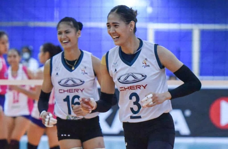 Two female volleyball players are laughing on the court after Chery Tiggo stuns Creamline in a thrilling match, setting up a winner-take-all battle for the PVL crown.