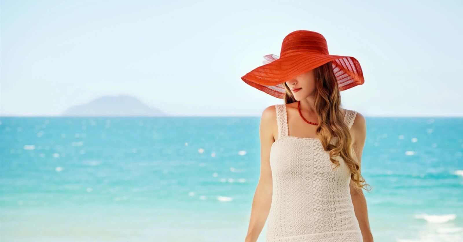 A woman in a white dress with a red hat stands by the ocean gazing at the clear sky and distant island She daydreams about her next escape perhaps enjoying Pinoy movies on free streaming sites as waves whisper secrets of far-off adventures