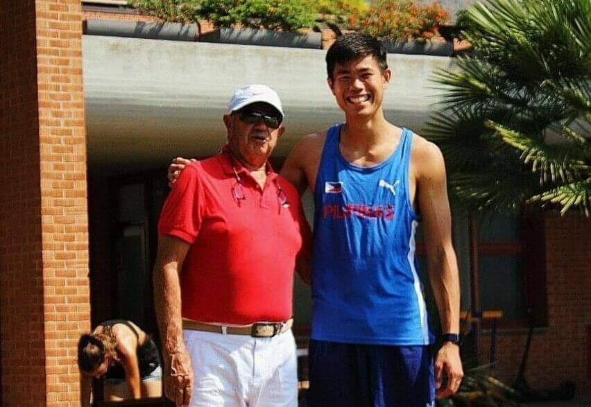 Two men standing next to each other in a park discuss the EJ Obiena 'witch hunt' that misled Vitaliy Petrov.