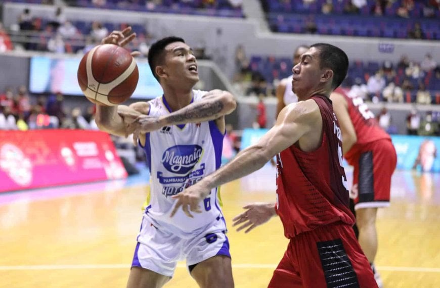 A basketball player is trying to block a ball from another player as the PBA postpones all games this week.