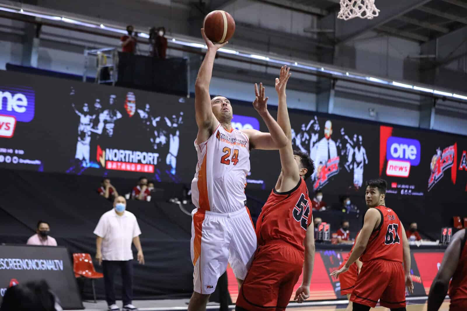 Greg Slaughter, former Northport big man, attempts to block a shot in a game.