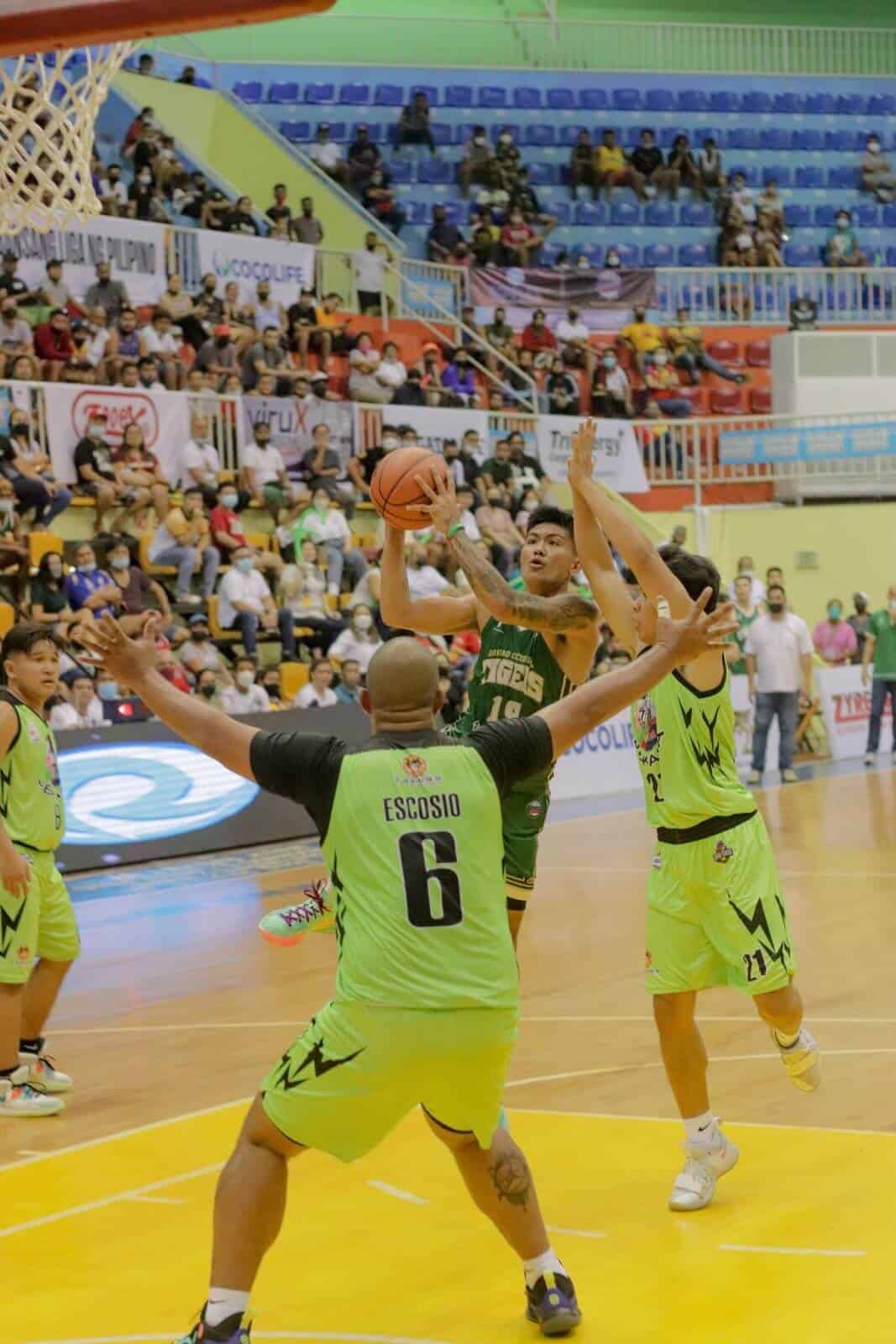 A group of men in green uniforms participates as Pilipinas Super League opens.
