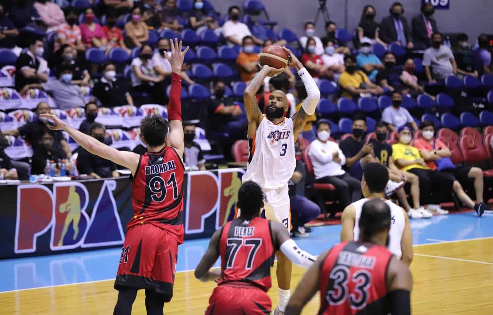 A basketball player blocks a shot during a game against San Miguel in the PBA Governors' Cup.