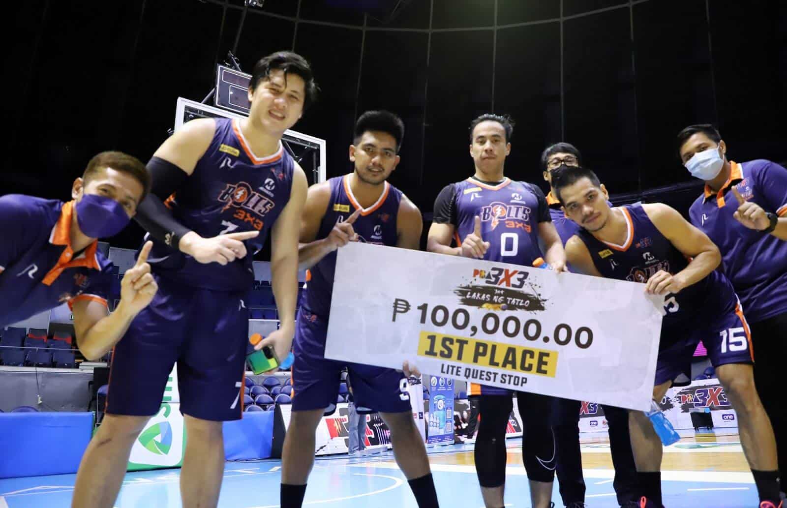 Meralco basketball players posing with a large check.