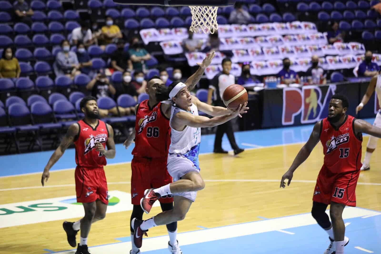 A basketball player is trying to block a shot in the PBA Governors’ Cup.