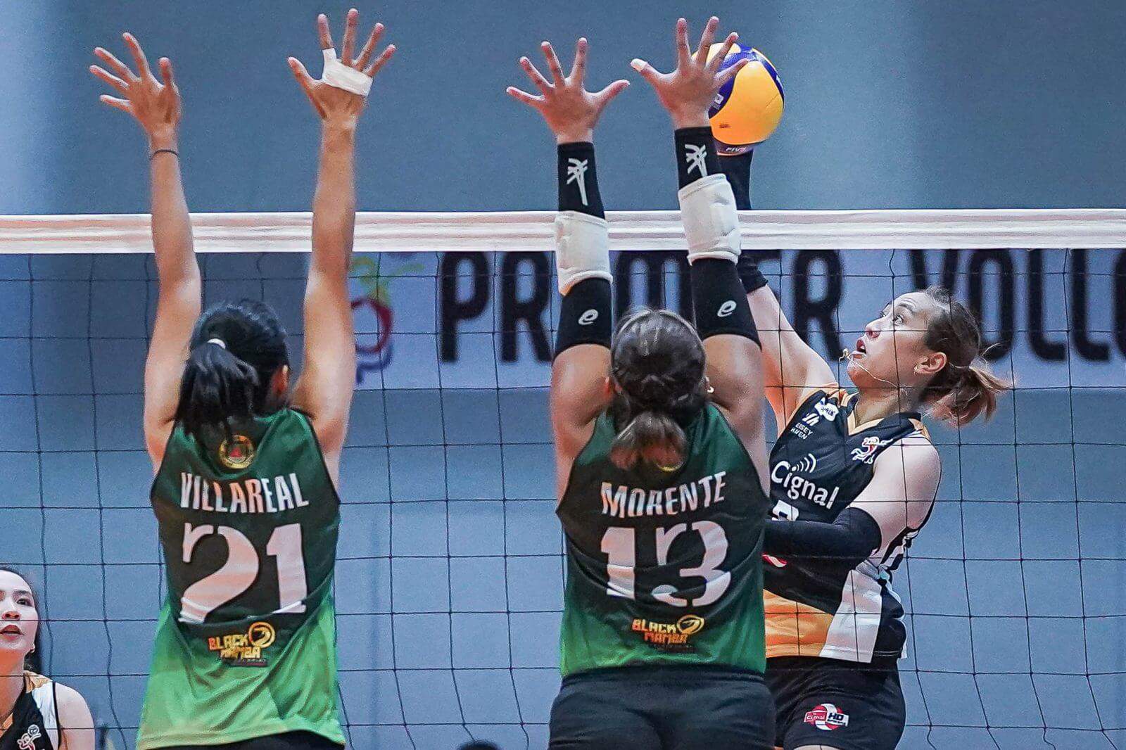 A group of female volleyball players blocking the ball during a sweep in the PVL Open Conference.