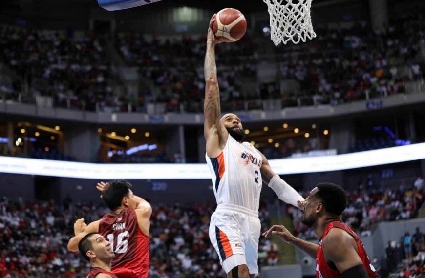 A basketball player dunks in the intense Game Three of PBA Governors' Cup Finals where Meralco tackles Ginebra with an improved defense.