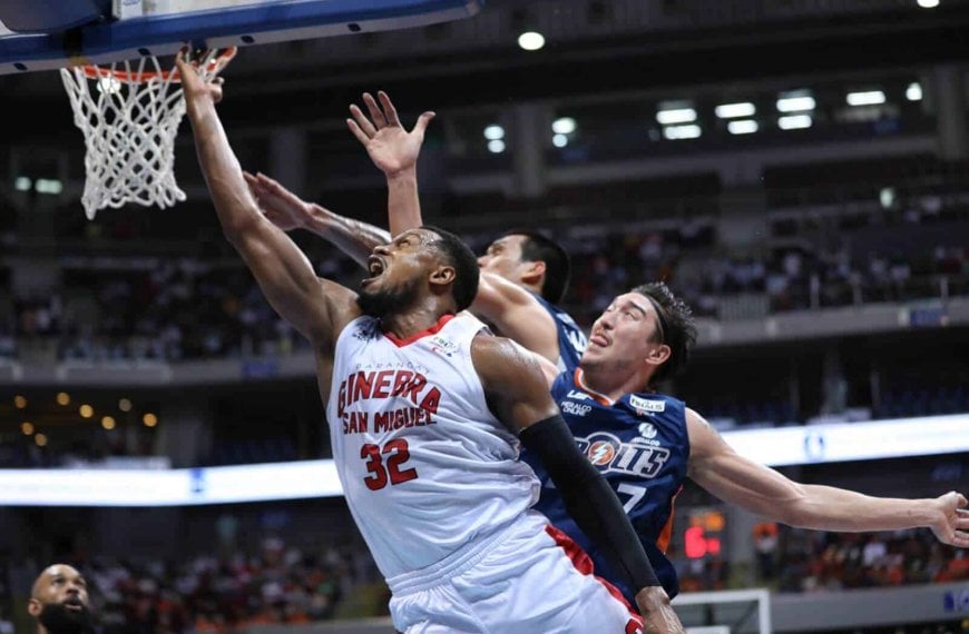 A basketball player dunks in the Governors' Cup Finals game tying series.