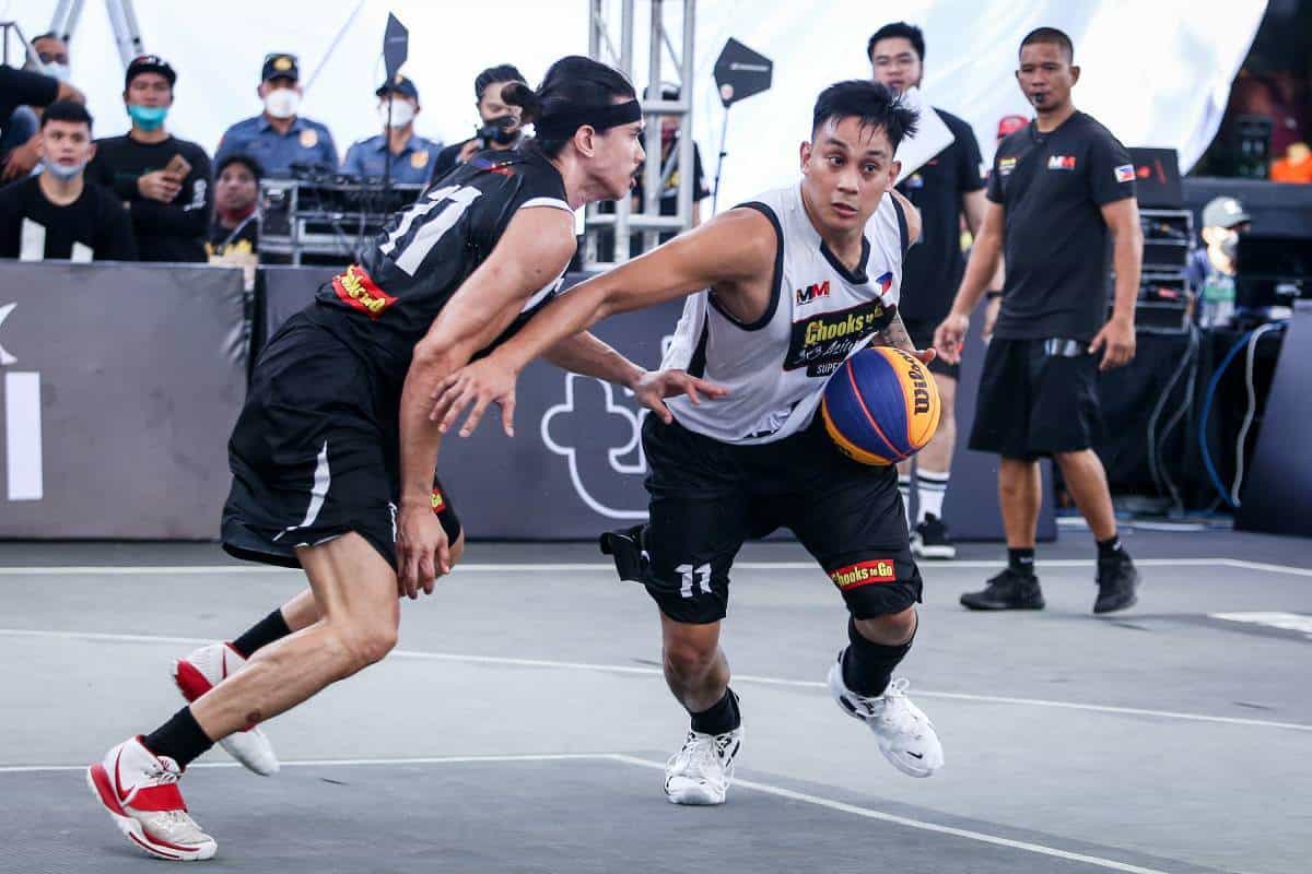 Two men playing basketball on a court in FIBA 3x3 WT Manila Masters.