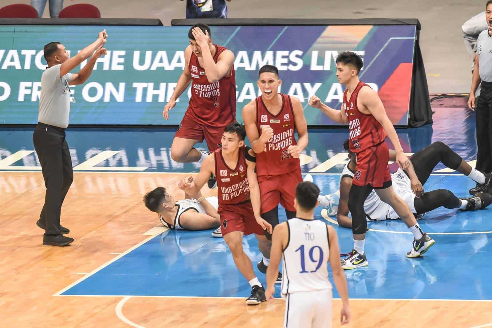 The UP Fighting Maroons celebrate on the court, one win away from the UAAP men's basketball title.