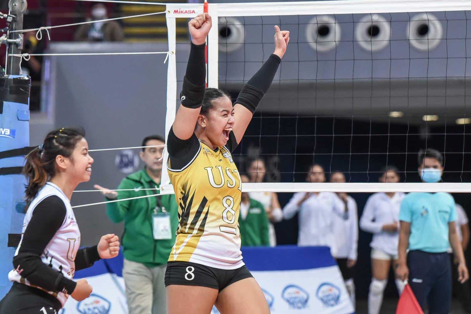 A female volleyball player celebrates after winning an instant classic match in UAAP women's volleyball.