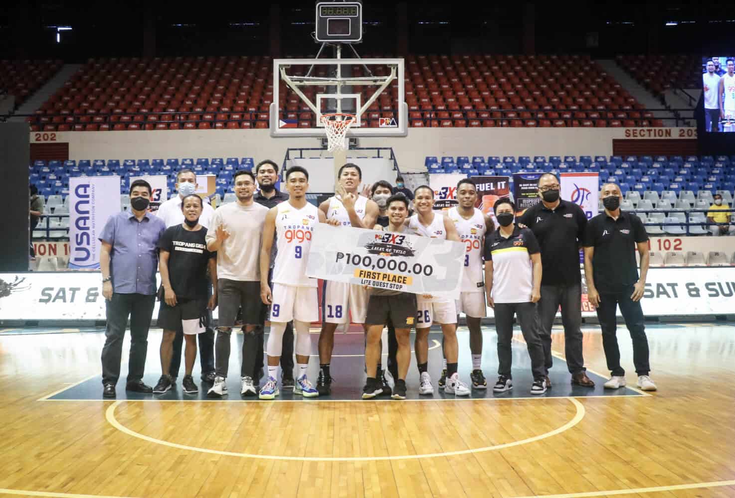 A group of men posing for a picture after TNT claims the PBA 3x3 Third Conference title.