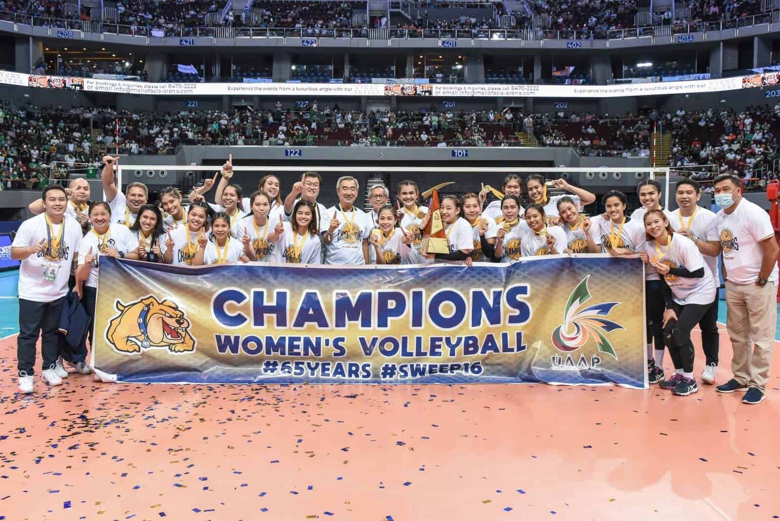 The Philippines women's volleyball team proudly displays the champions banner, concluding a perfect season.