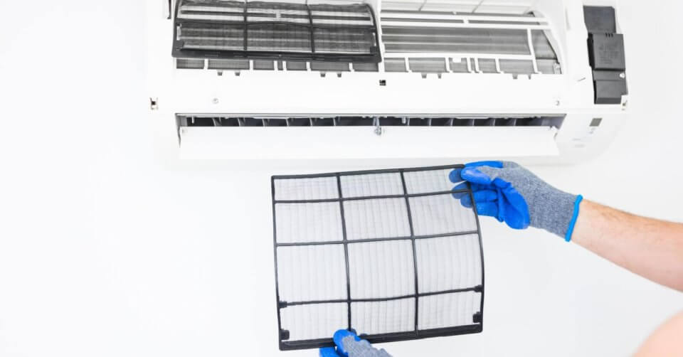 a man cleaning an air conditioner, a guide to choosing the right ac for your home.
