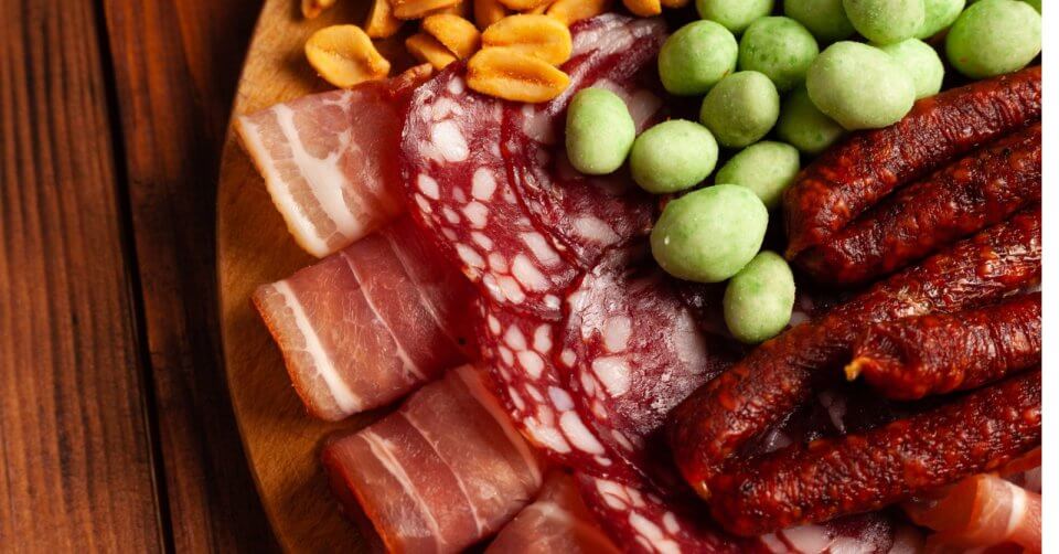 the ultimate charcuterie plate crafted with a variety of meats and vegetables.