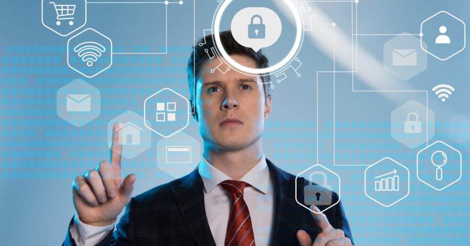 a man in a suit is holding a padlock in his hand, symbolizing data privacy act in the philippines.