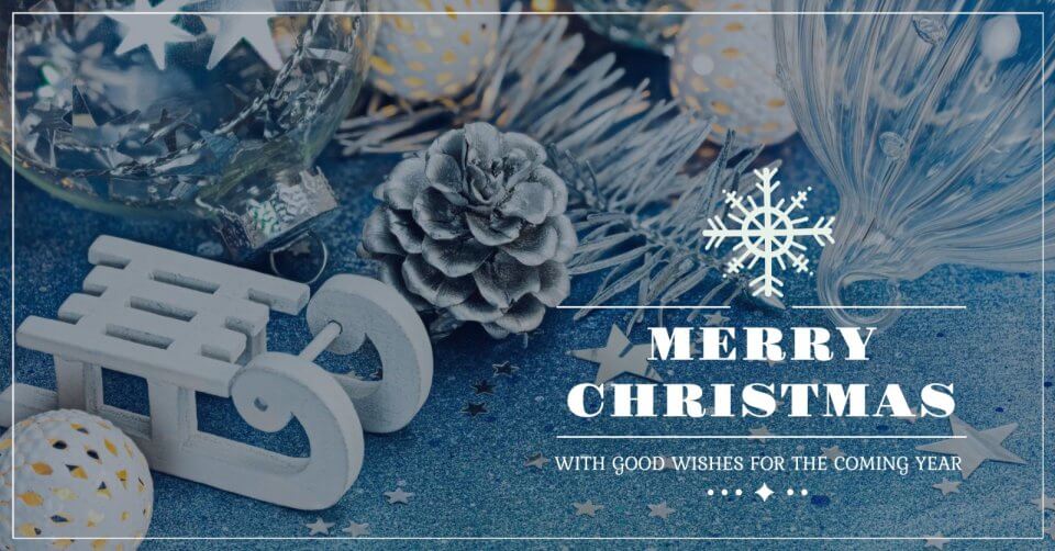 merry christmas wishes with snowflakes and decorations on a blue background.