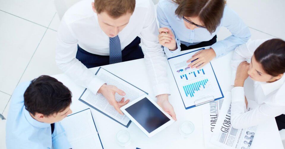 a group of experts from business consultancy firms sitting around a table in metro manila.