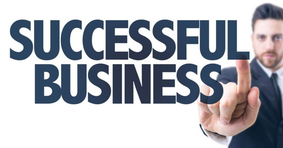 a businessman from metro manila pointing to the word successful business.