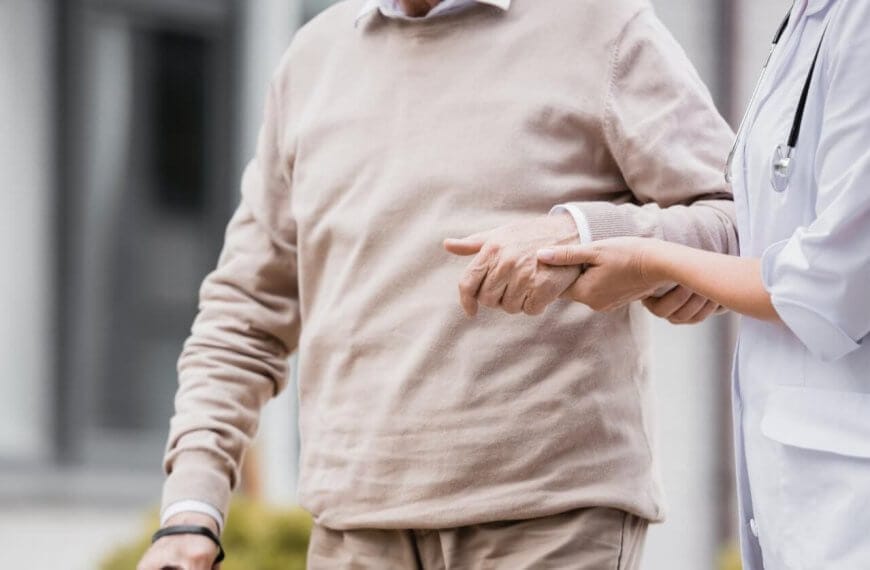 A doctor pointing at a man's hand in the Philippines.