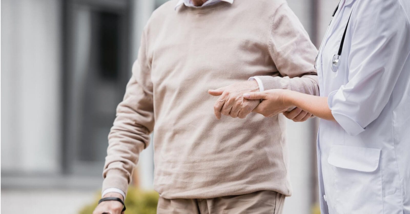 A doctor pointing at a man's hand in the Philippines.