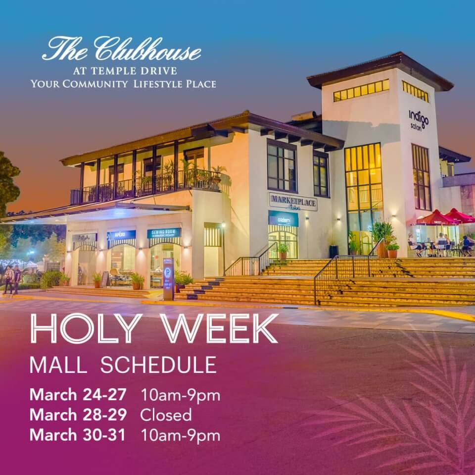 Nighttime view of the clubhouse at temple drive with a holy week mall schedule sign illuminated in the foreground.