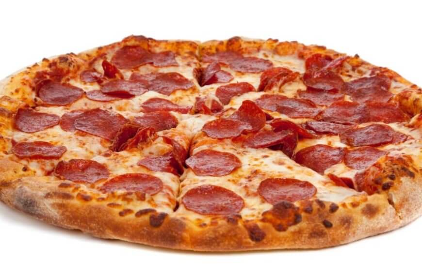 A whole pepperoni pizza from Angel's Pizza in the Philippines sits on a white background. It boasts a golden-brown, crispy crust, topped with melted cheese and evenly distributed pepperoni slices. The cheese is slightly browned in spots, indicating it's freshly baked to perfection.