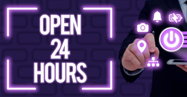 A person in a dark suit taps a glowing purple pinpoint icon on a virtual screen. Surrounding icons include a camera, bell, volume, power button, and a graphic of connected nodes. The text "24 HOUR DINING" is prominently displayed, also in purple, against a dark background with a brick pattern.