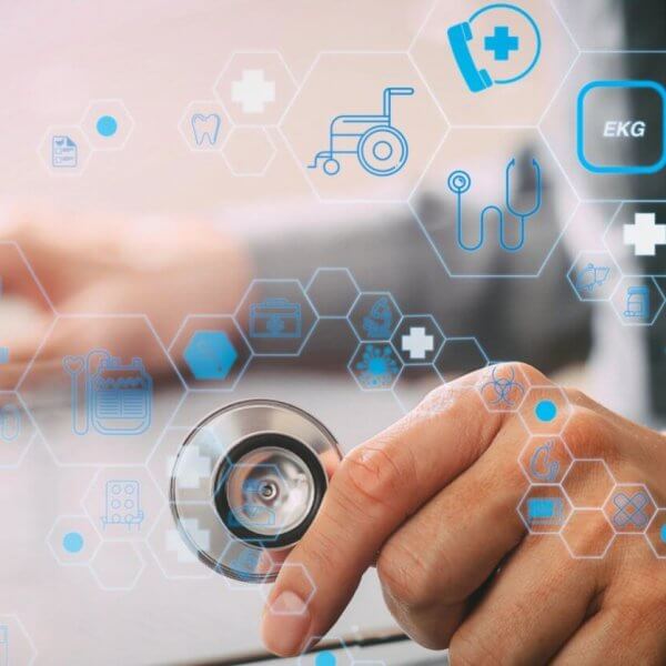 Hands holding a stethoscope with medical icons and hexagons overlayed, symbolizing digital healthcare innovation in Metro Manila.