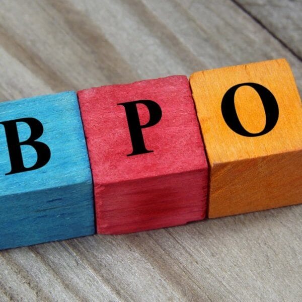 Colorful wooden blocks on a wood surface spell BPO in bold black letters, symbolizing the dynamic career growth opportunities offered by BPO companies in Makati City.