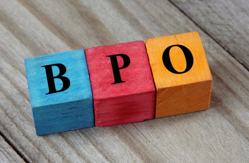 Colorful wooden blocks on a wood surface spell BPO in bold black letters, symbolizing the dynamic career growth opportunities offered by BPO companies in Makati City.